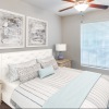 a bedroom with a bed and two nightstands