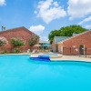a swimming pool in front of a building