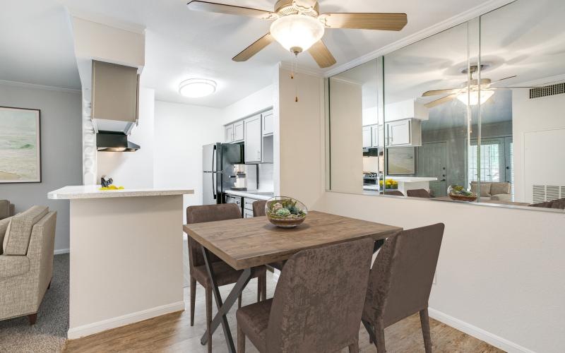 a kitchen with a table and chairs