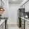a kitchen with white cabinets