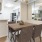 a kitchen with a table and chairs