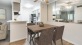 a kitchen with a table and chairs
