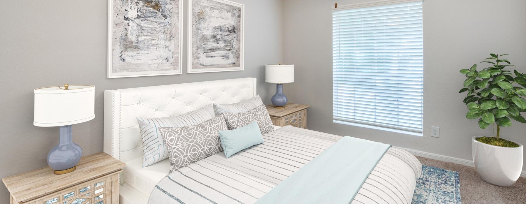 a bedroom with a fan and a bed
