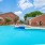 a swimming pool in front of a brick building