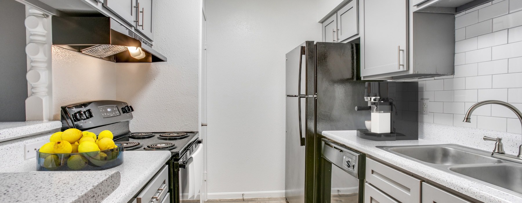 a kitchen with white cabinets