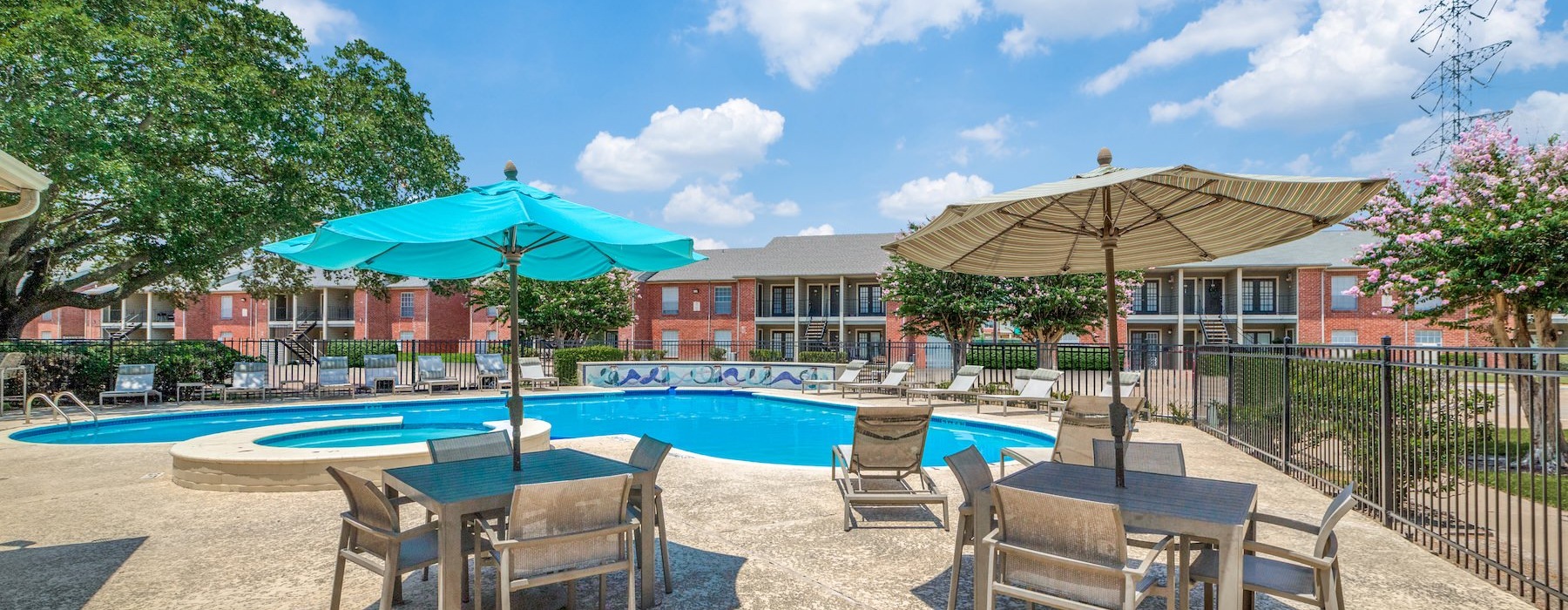 a pool with chairs and umbrellas