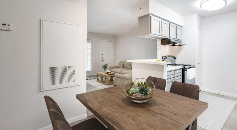 a kitchen with a table and chairs